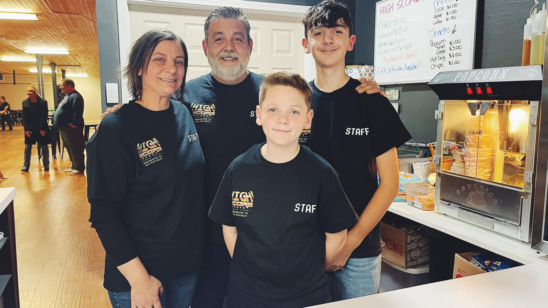 owners of the high score arcade lounge with their children