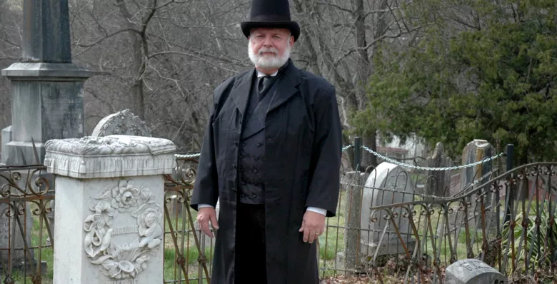 Man stands in the Old Jonesborough Cemetery in Jonesborough Tennessee