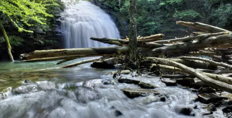 Enjoy the many cascades of Stinging Fork Falls from a hidden gem hiking trail