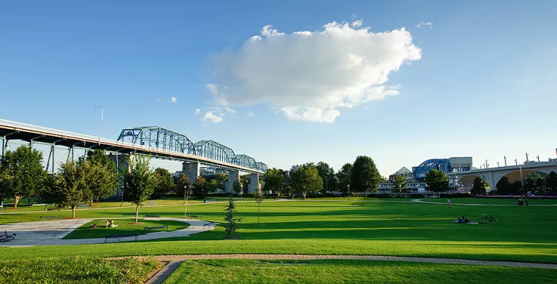 Wide open field of fresh cut grass,  Down by the lazy river, Take a walk on a winding path, Where neighbours come together. Written about Tennessee Riverfront Park in Chattanooga, Tennessee.