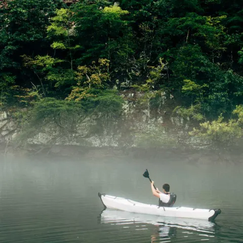 Mist rises in the early morning light while kayaking along South Holston lake in Bristol, Tennessee