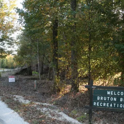 The welcome sign and entry drive for Bruton Branch Recreation Area
