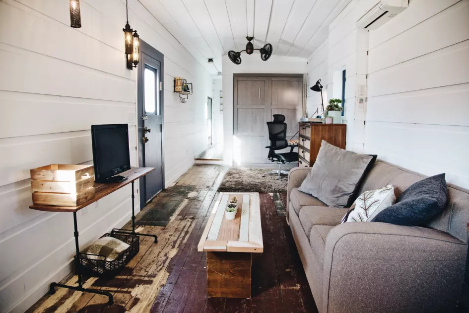The living space has a TV and sofa. The sofa can pull out into a queen sized bed and the TV has access to Netflix, Amazon Prime TV, Disney+, and HBO