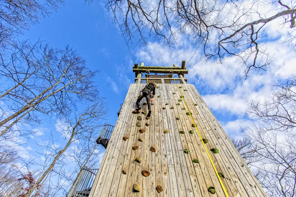 Person climbs 40-foot rock climbing wall