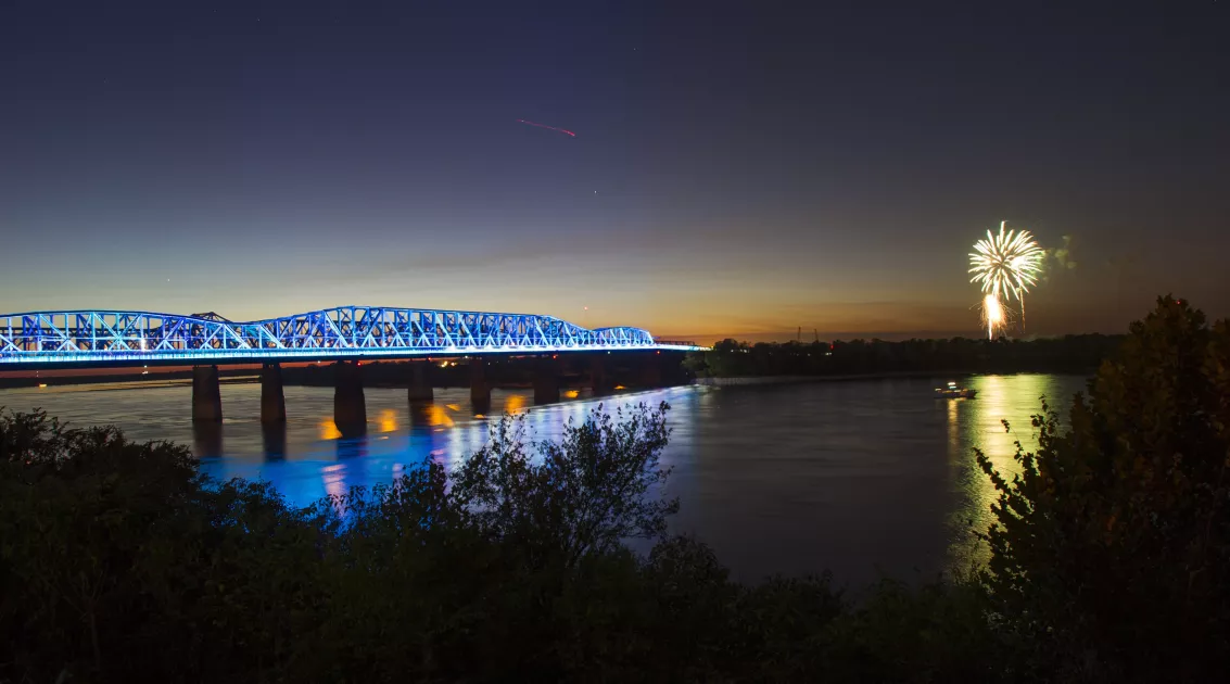 The Mighty Lights shine on Big River Crossing while fireworks occur in West Memphis.