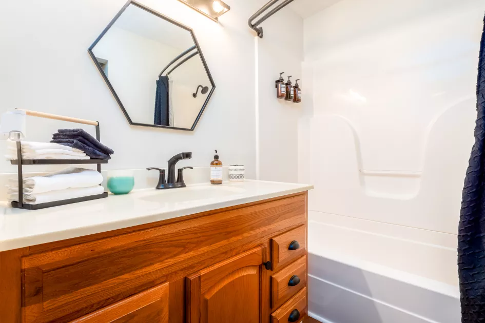 Clean bathroom equipped with amenities such as makeup cloths, bodywash,  shampoo, and conditioner!