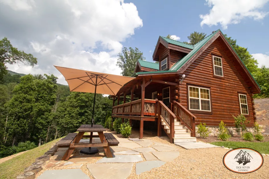 One Big Bear Cabin: 3 Bed, 2 Bath luxury cabin with hot tub, grill, fully equipped kitchen, fireplace, and private campsite at Doe River Landing, campground in Roan Mountain, Tennessee.