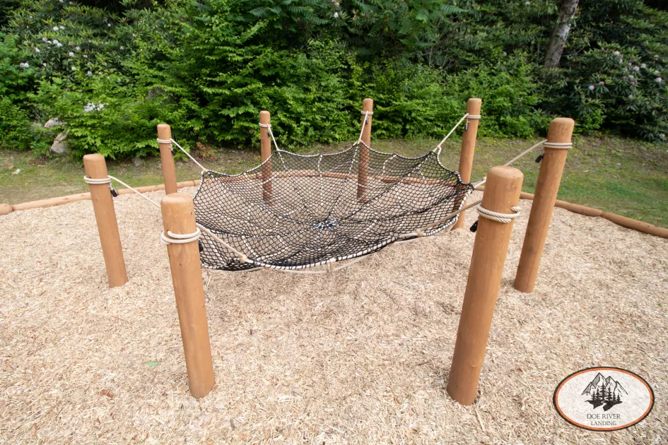 A web of nets is the final challenge in the obstacle course located in the playground at Doe River Landing, campground in Roan Mountain, Tennessee.
