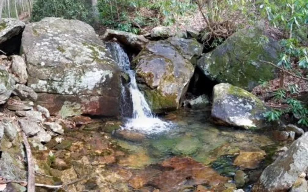 View of water falling into a  pool of water.